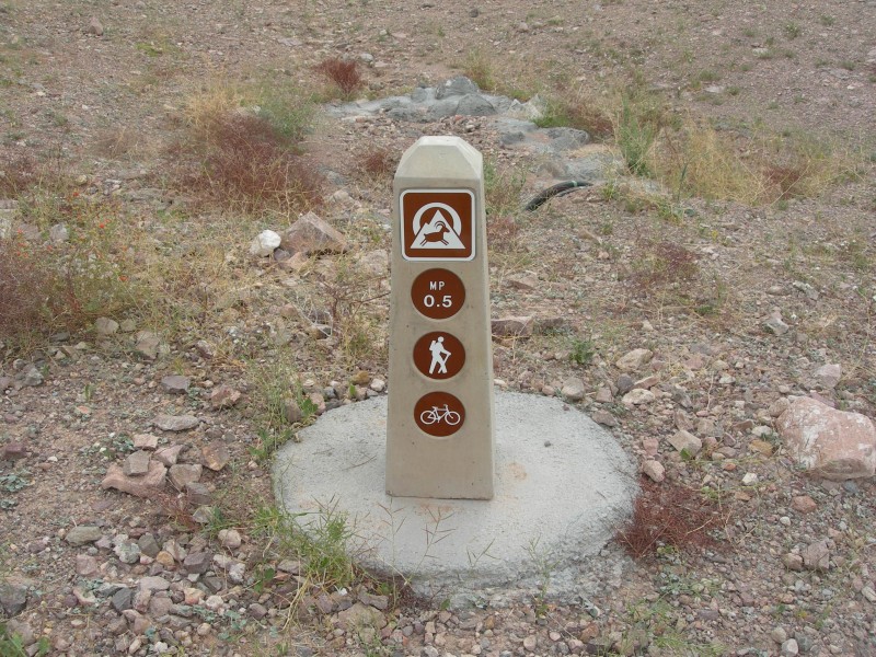 Trail Sign Loop. Image Trail Logo Signs & Mileage Buttons installed - River Mountains Loop Trail